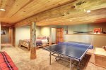 Deer Haven Lodge loft area with a Queen, two futons and foosball. 